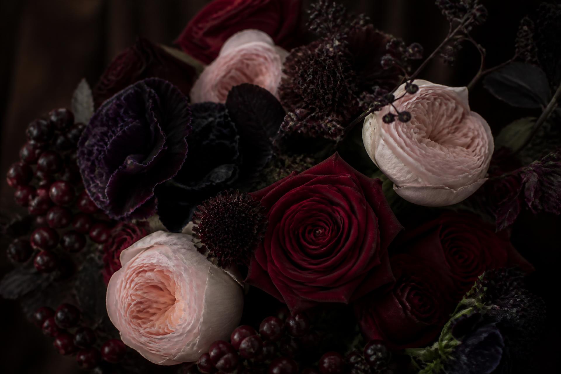 Dark moody bouquet of crimson and blush garden roses